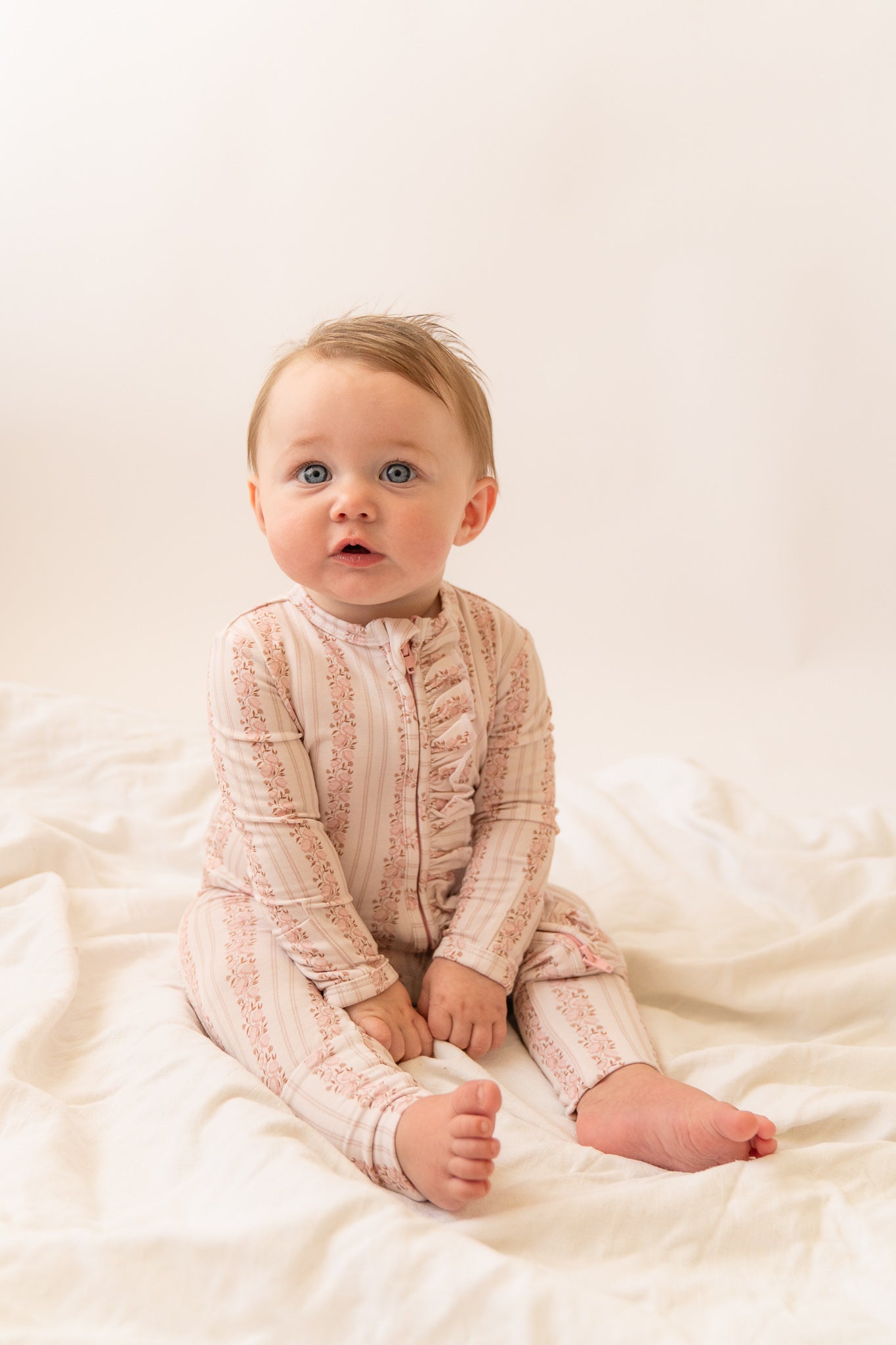 Rosy Reverie Ruffles Zip Romper Onesie