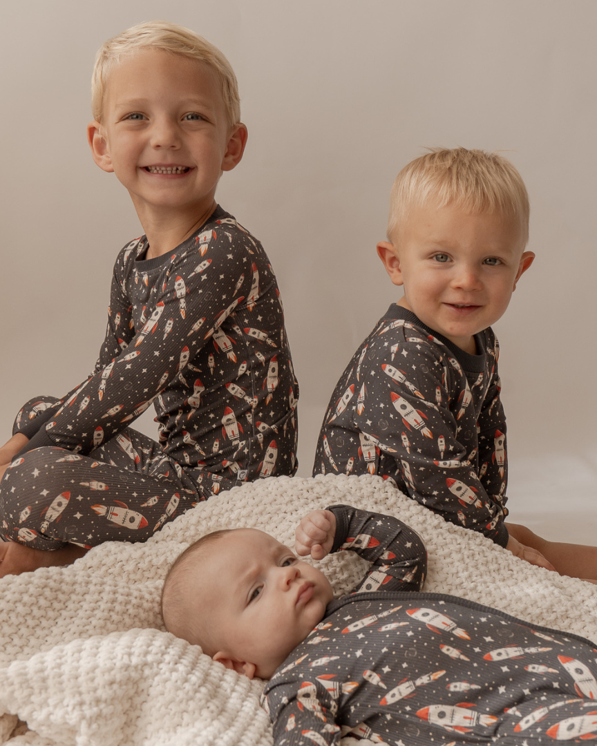 Three Children in Matching Rocket Ship Bamboo Pajamas by Little Nessi